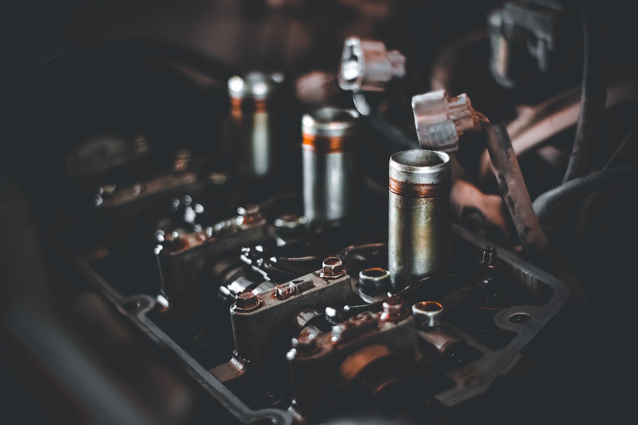 Mastering the First Impression: Your intriguing post title goes here Detailed view of engine parts showcasing camshaft and cylinder head mechanics.